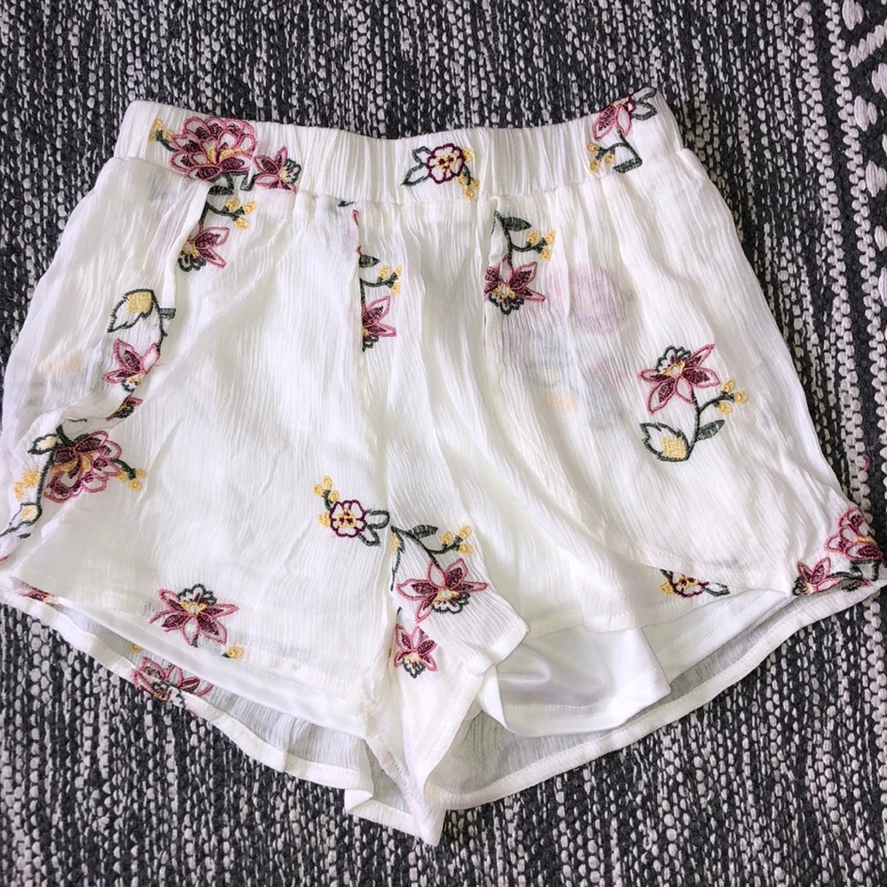 Flowy white and floral shorts